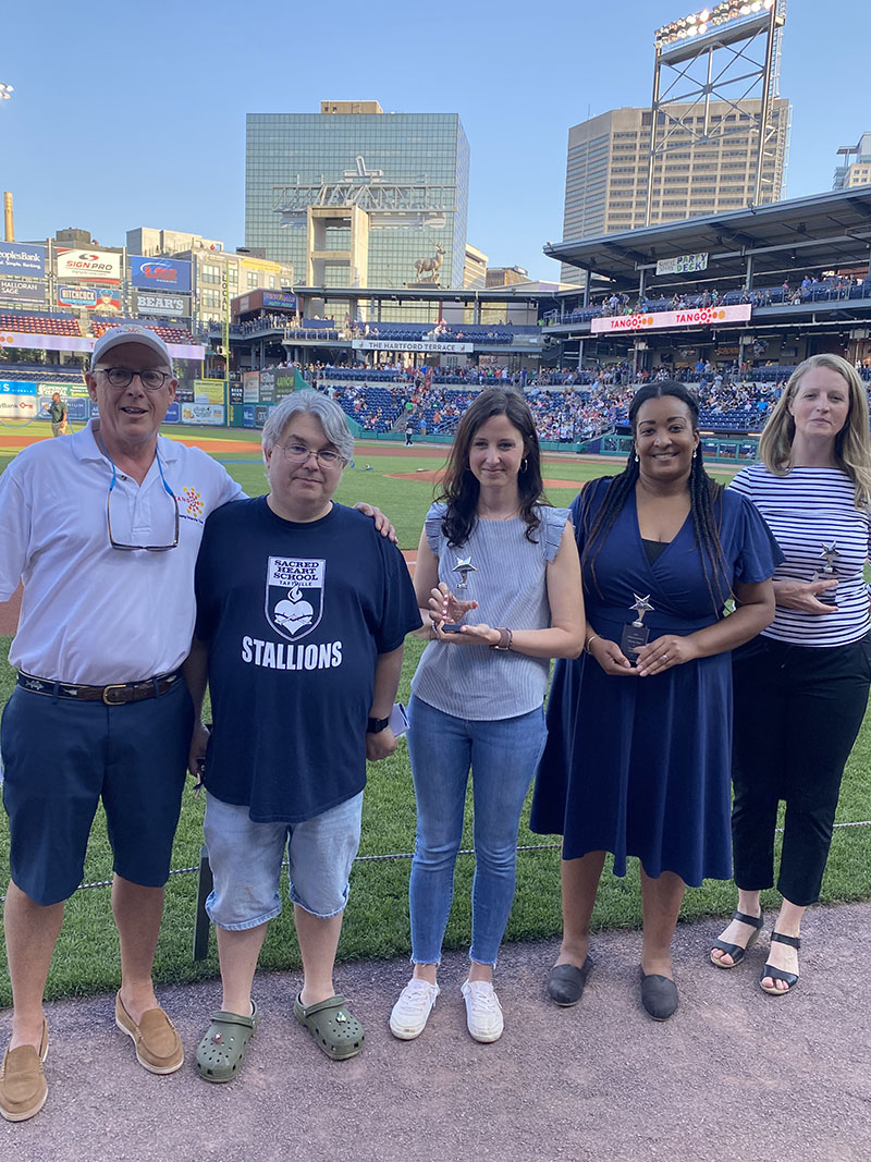 TANGO Nonprofit Rising Star Scholarship winners with Rollin Schuster at the Hartford Yard Goats
